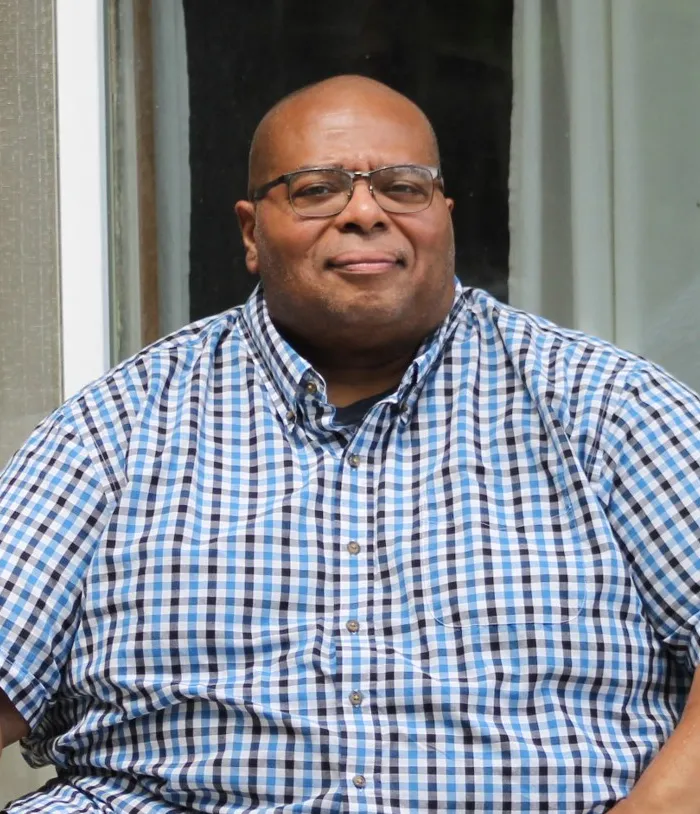 Rev. Patrick Ian Jackson in a dark suit